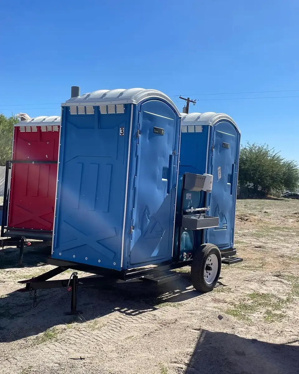 Porta potties on a transport trailer