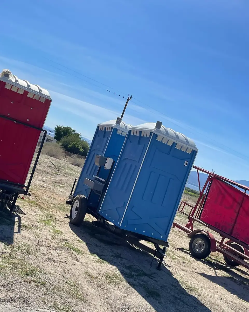 Porta potties loaded on a delivery trailer ready for a route
